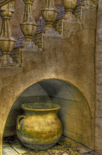 AZ, Sedona Ceramic pot in niche under stairway